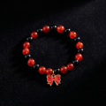Handmade Red and Black Crystal Glass Bead Stretch Bracelet with Gold Enamel Bow Charm
